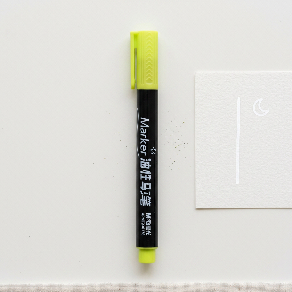 M&G oil-based paint marker flatlay with marked sample
