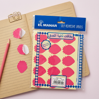 El Manar red strawberry reward sticker sheet flatlay with peeled stickers
