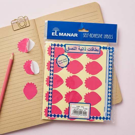 El Manar red strawberry reward sticker sheet flatlay with peeled stickers
