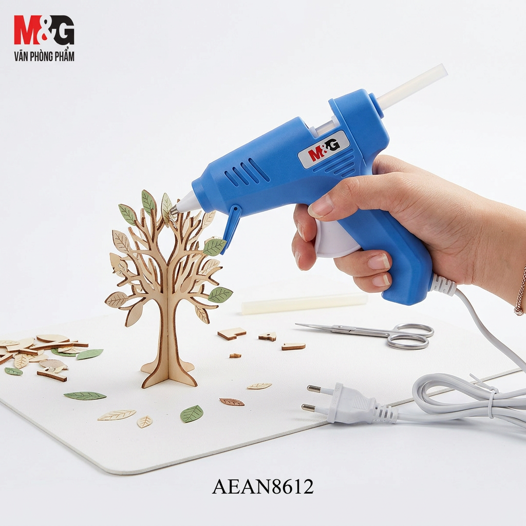 M&G Chenguang hot melt glue gun in use on a DIY craft project