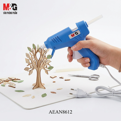 M&G Chenguang hot melt glue gun in use on a DIY craft project