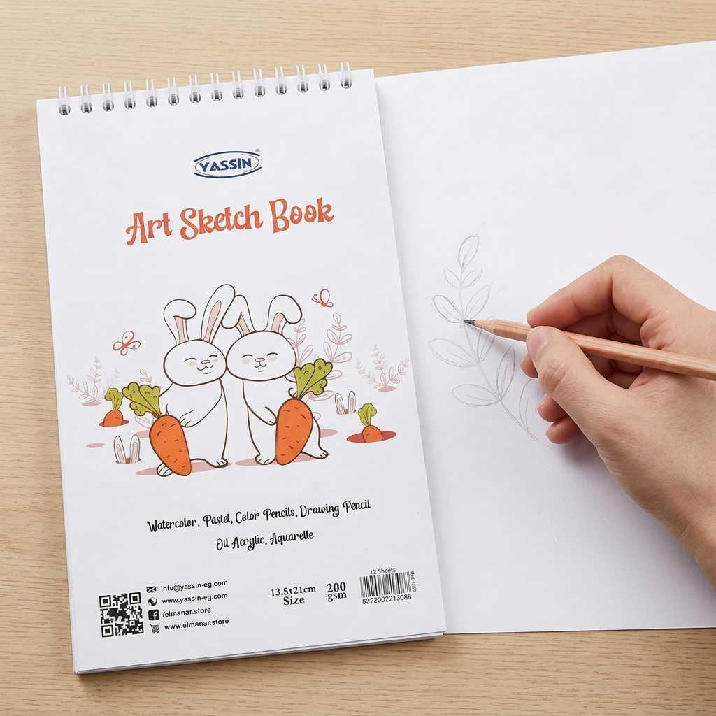 Hand sketching in the open Yassin small white wire-bound sketchbook