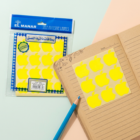 El Manar yellow apple reward sticker sheet flatlay with peeled stickers