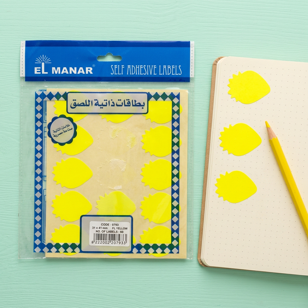 El Manar yellow strawberry reward sticker sheet flatlay with peeled stickers