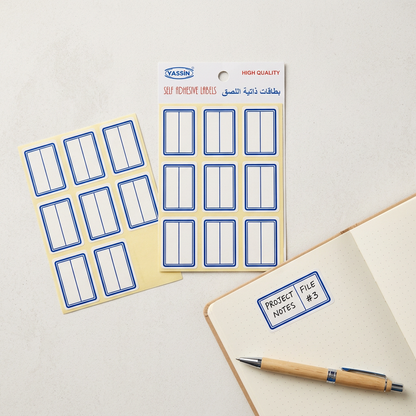 Yassin white blue-bordered labels pack flatlay with handwritten label