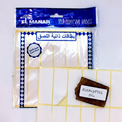 El Manar white labels pack flatlay with handwritten folder label