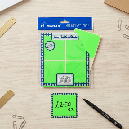 El Manar fluorescent green labels pack flatlay with handwritten price label