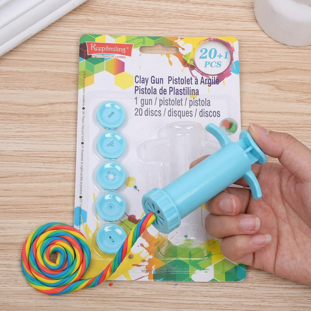 Keep Smiling clay extruder gun in use pressing out colorful clay