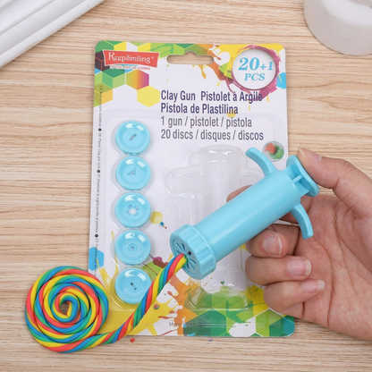 Keep Smiling clay extruder gun in use pressing out colorful clay