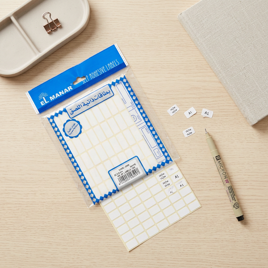 El Manar white 8x14mm labels pack flatlay with peeled labels and marker
