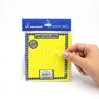 Applying a small El Manar 15x10mm price label to a retail item