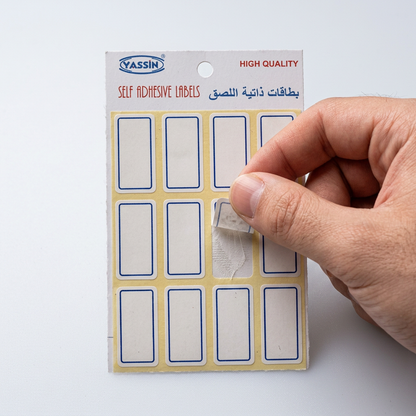 Pricing a glass jar with a small Yassin white blue-bordered label
