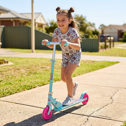 Girl riding the LOL Surprise folding scooter on a sidewalk